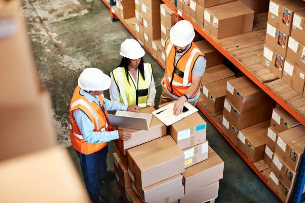 Retail warehouse team reviewing inventory